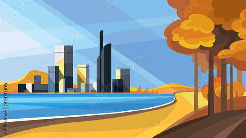 City by the lake. Autumn cityscape with golden trees.