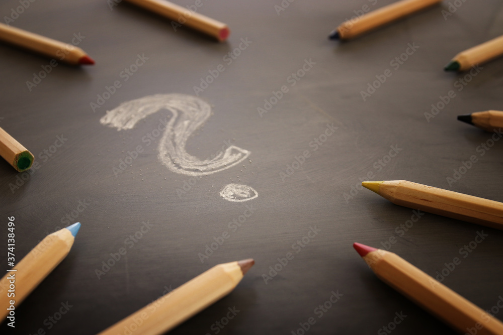 Background image of pencils over chalkboard and chalkboard Stock Photo
