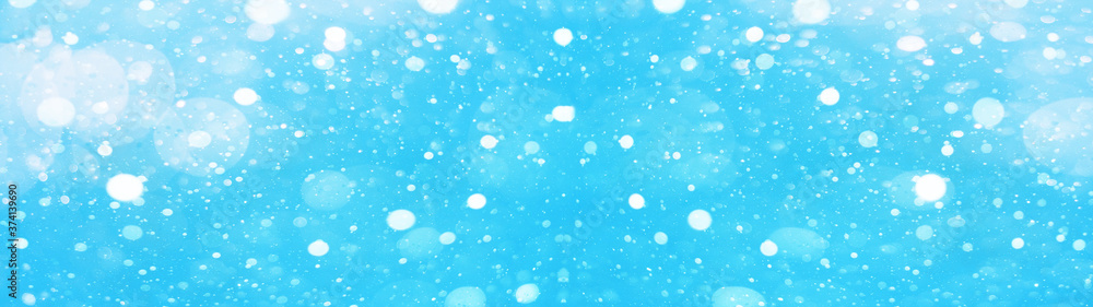 snowflakes isolated on blue sky - winter weather snow background panorama banner long