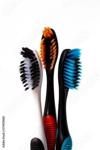 toothbrushes  three pieces colored  horizontal on a white background