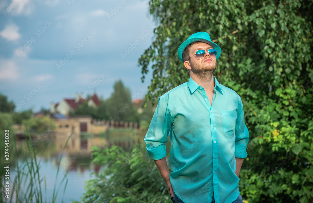 Young guy in turquoise shirt fashion outfit for men clothes