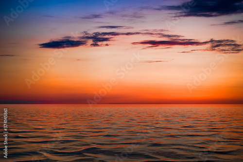 bright sunset over the blue sea