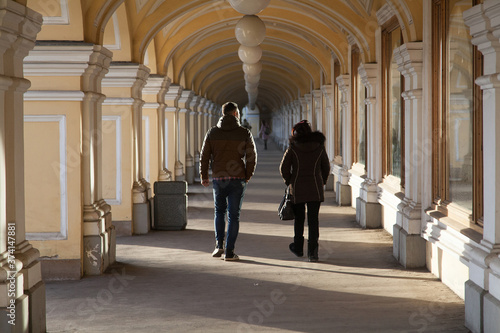 People walk through the gallery of old shopping malls photo