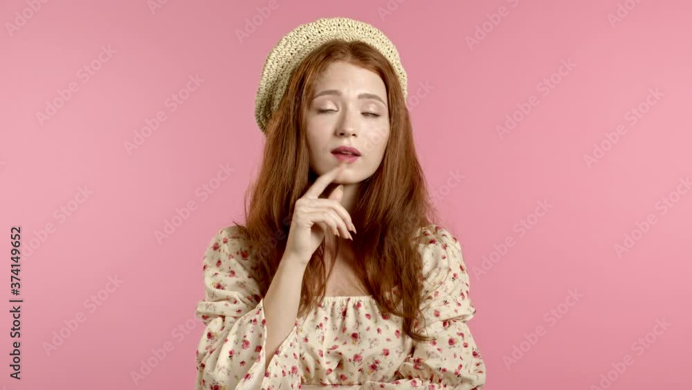 Portrait of young thinking pondering woman in beret having idea moment pointing finger up on pink studio background. Smiling happy girl showing eureka gesture. Portrait of young thinking pondering woman in beret having idea moment pointing finger up on pink studio background. Smiling happy girl showing eureka gesture.