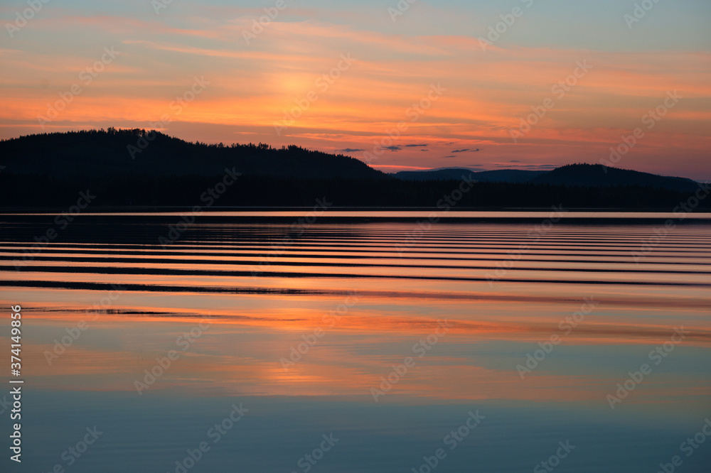 White nights over the calm nordic forest lake White nights over the calm nordic forest lake