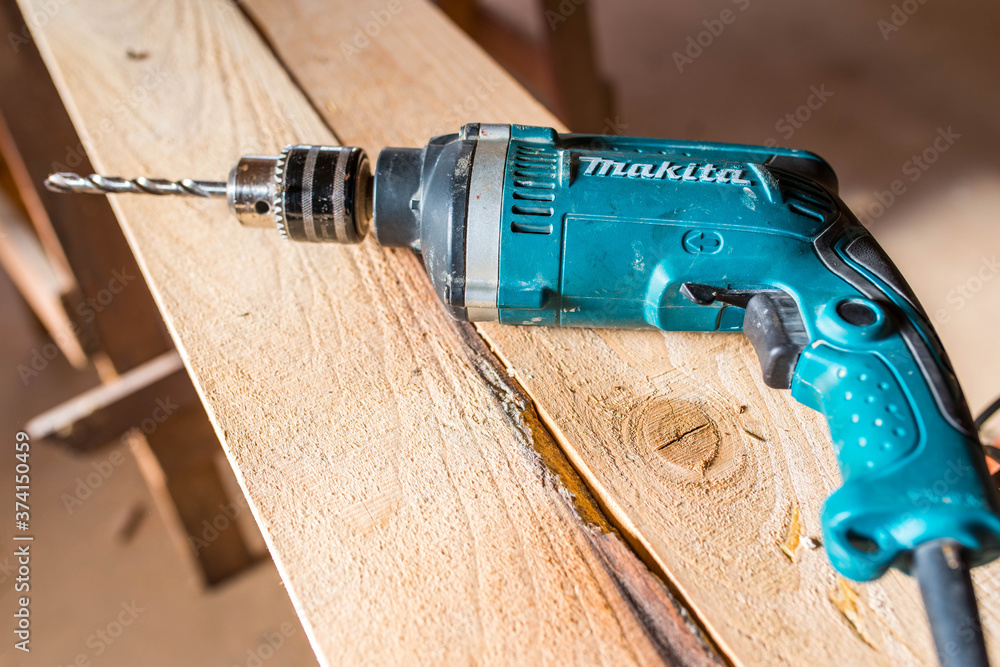 Miercurea Ciuc, Romania- 27 August 2020: Used Makita drilling machine on  rough pine wood boards in a small woodworking shop. Stock Photo | Adobe  Stock