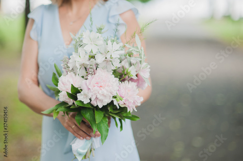 Wedding bouquet in brides hands