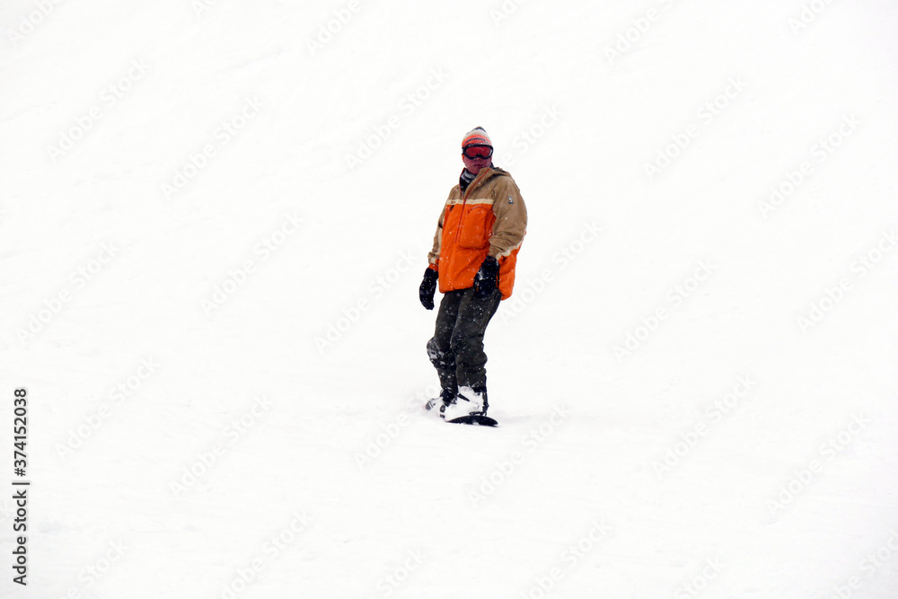 FEB 17, 2018 IWATE, JAPAN : Asian snowboarder is riding with snowboard from powder snow hill FEB 17, 2018 IWATE, JAPAN : Asian snowboarder is riding with snowboard from powder snow hill