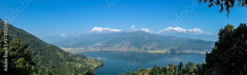 Panoramic view on Phewa Lake from World Peace Pagoda in Pokhara  Nepal. In the back there are high  snow capped Himalayan chains  with Mt Fishtail  Machhapuchhare  between them. Serenity and calmness