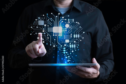 Businessman with digital human brain interface link with digital tablet, Artificial Intellegent hologram concept