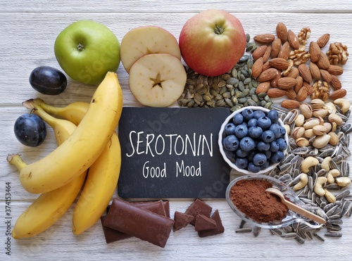 Serotonin-boosting foods. Assortment of food for good mood, happiness, better memory, and positive mind. Healthful foods rich in serotonin. Natural sources of serotonin, healthy diet. photo