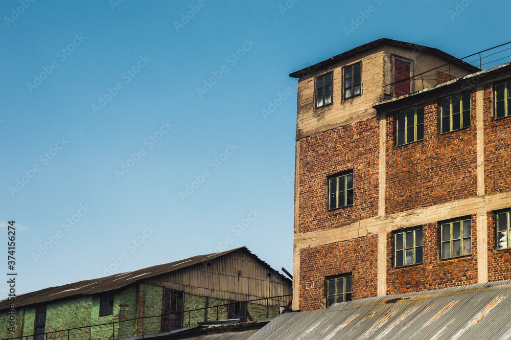 Old dilapidated red and green brick houses. High quality photo