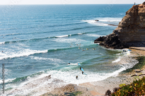 Surfers entering the sea