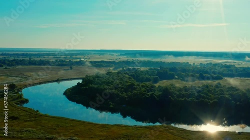 Wallpaper Mural Aerial view of sunrise with a blue sky above river Desna, Ukraine. Drone flies forwards above beautiful morning landscape with a fog while  sunrise. Drone flies over tranquil summer landscape. Torontodigital.ca