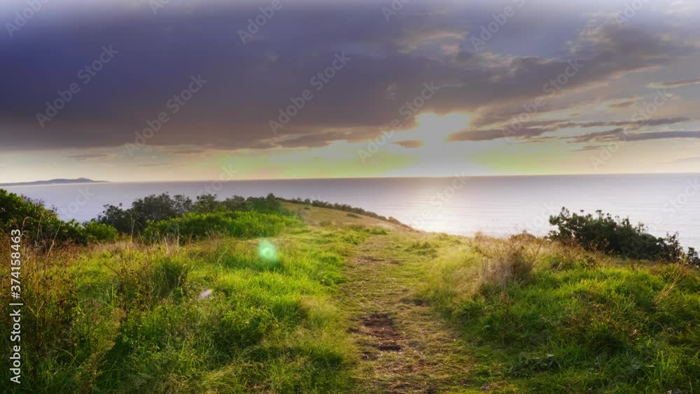 Lovely View Of Sunrise Shining Over The Calm Sea - Lush Coastal Near Crescent Head Beach - Sydney, NSW, Australia. - wide static shot Lovely View Of Sunrise Shining Over The Calm Sea - Lush Coastal Near Crescent Head Beach - Sydney, NSW, Australia. - wide static shot