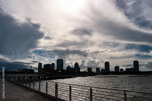 Silhouette view of the downtown St. Pete skyline on a beautiful cloudy day from the pier. © Zoe Cappello