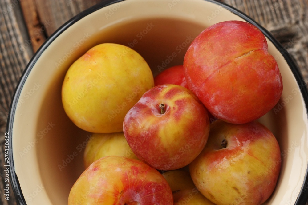 Juicy seasonal plums on the table macro Juicy seasonal plums on the table macro