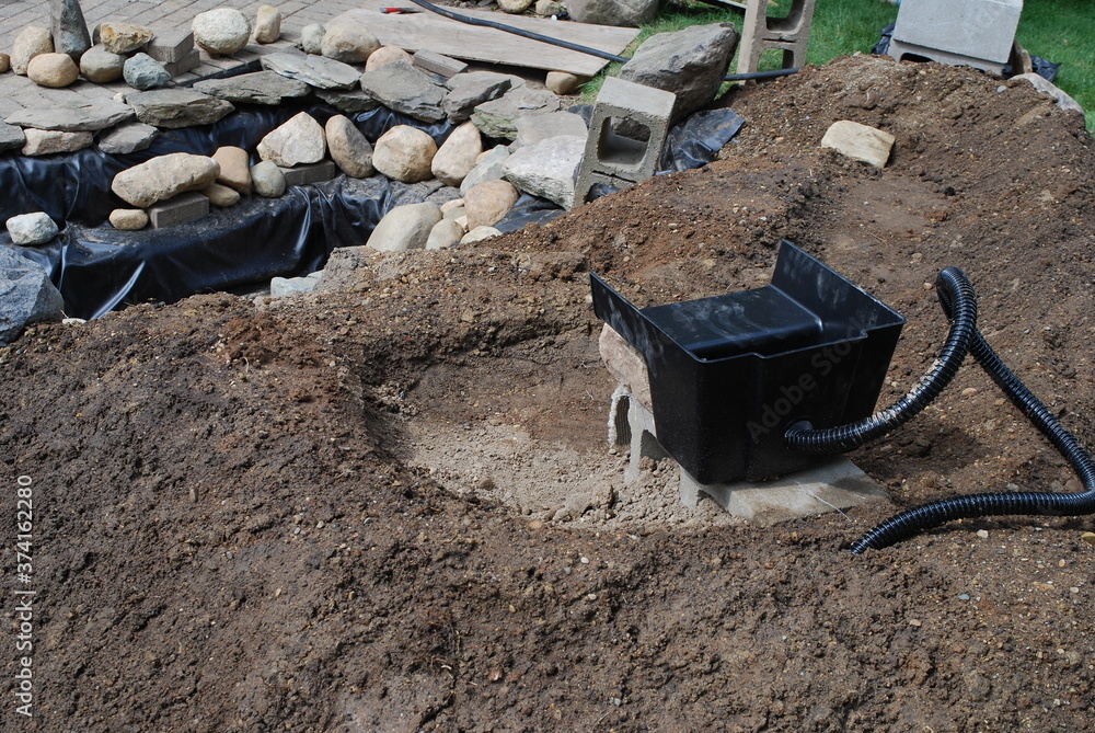 Placing a spillway for a waterfall/pond project and layng the water