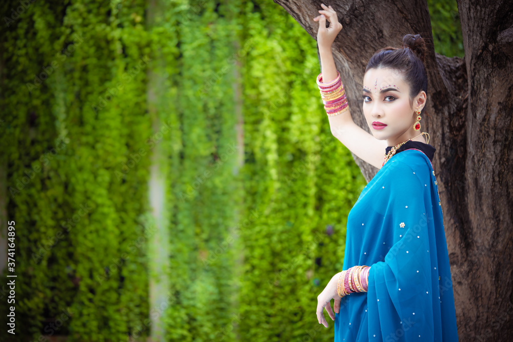 Portrait of young asian girl with kundan jewelry set and traditional hindu Indian costume saree and lehenga dress model Portrait of young asian girl with kundan jewelry set and traditional hindu Indian costume saree and lehenga dress model