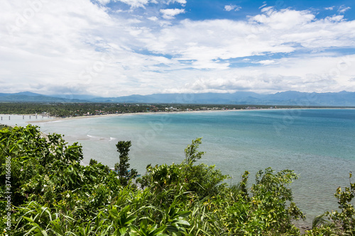 View of Sabang Beach and Baler Bay from Ermita Hill. In Baler, Aurora Province, Philippines photo