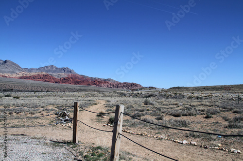red rock layered rock mountain in desert