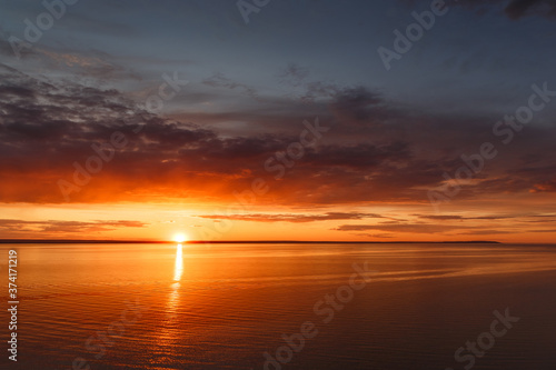 Beautiful view of the sea and sunset. Beautiful nature landscape with dramatic clouds sunset sky and views of the sea surface. Postcard view. Nature. Concept. Golden sunset