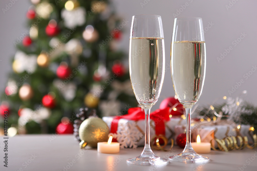 glasses with champagne on the table. Background with place for text for the new year holiday glasses with champagne on the table. Background with place for text for the new year holiday
