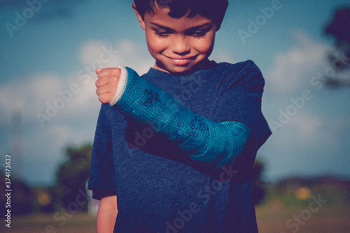 boy with a cast on his arm 