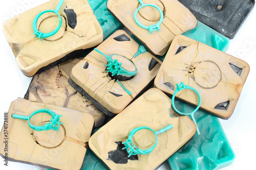 Silica rubber molds, silver molds, many green and blue wax rings, used in the manufacture of jewelry in the jewelry industry.