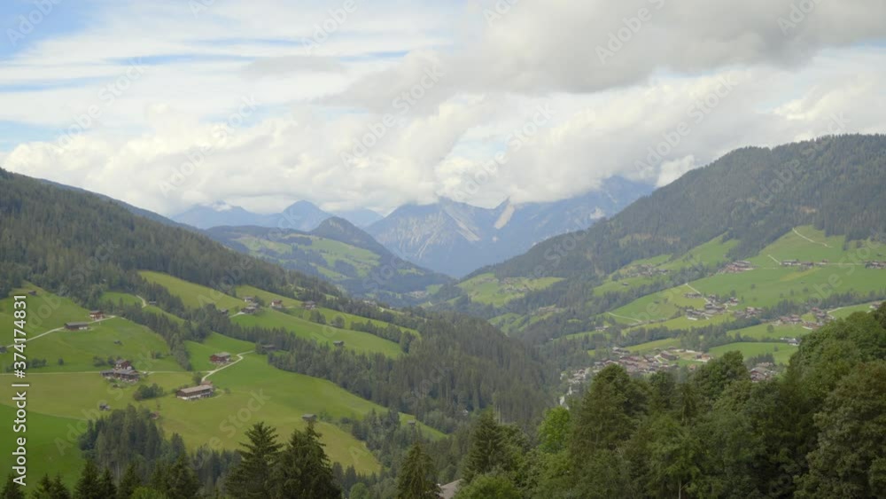 Beautiful landscape of a village in the Alps on a sunny day. Beautiful landscape of a village in the Alps on a sunny day.