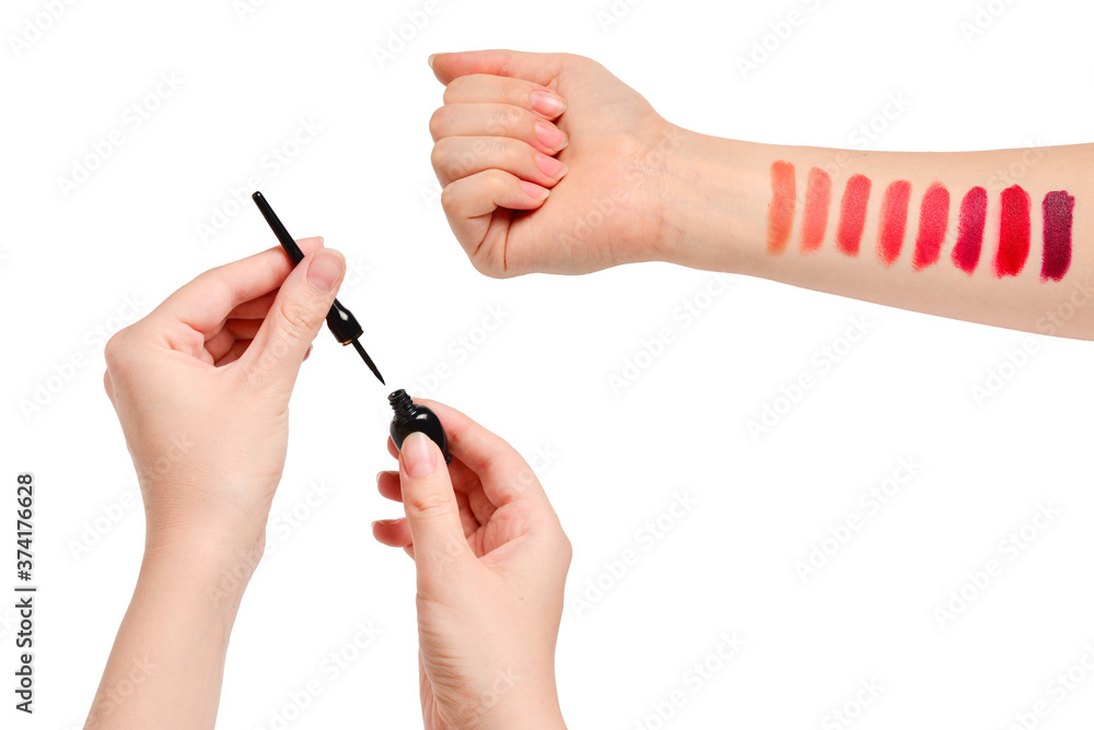 Lipstick swatches on woman hand isolated on white background. Lipstick swatches on woman hand isolated on white background.