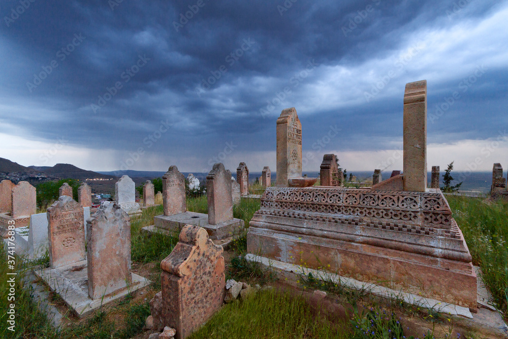 Ancient muslim cemetery on a stormy day in Mardin, Turkey.