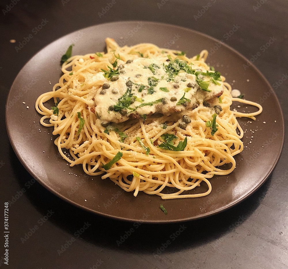 Chicken piccatta with spaghetti and lemon capers Chicken piccatta with spaghetti and lemon capers