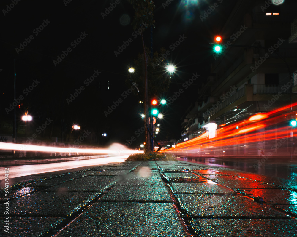 Night lights of a car passing by 
