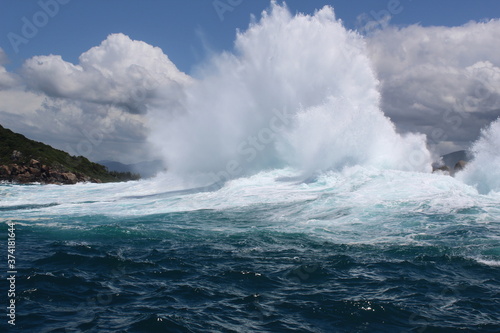wave crashing on an islet