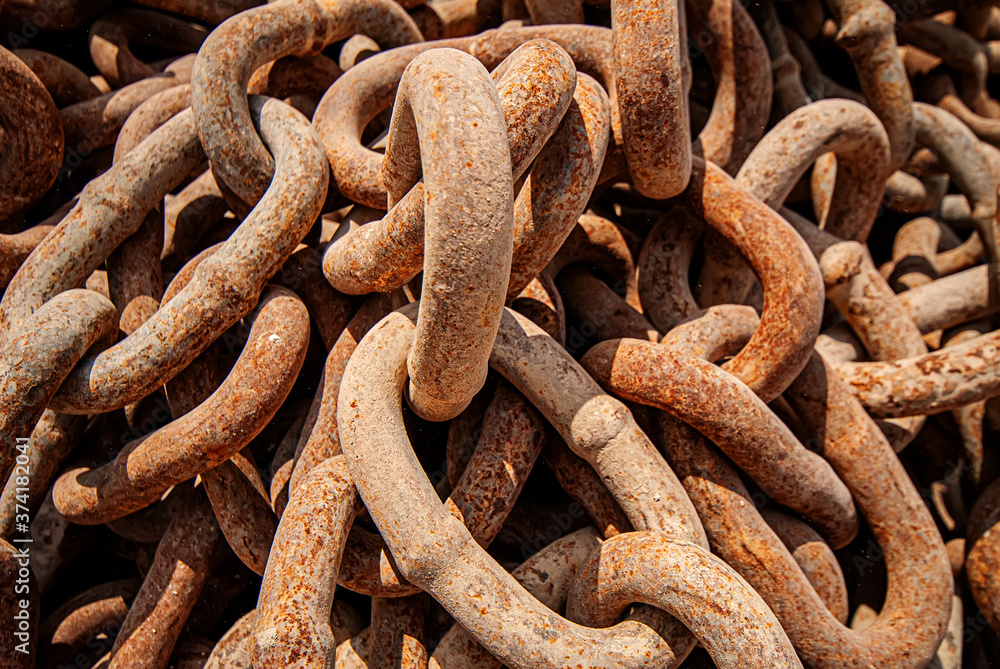 old rusty industrial chains for lifting loads, close-up. old rusty industrial chains for lifting loads, close-up.