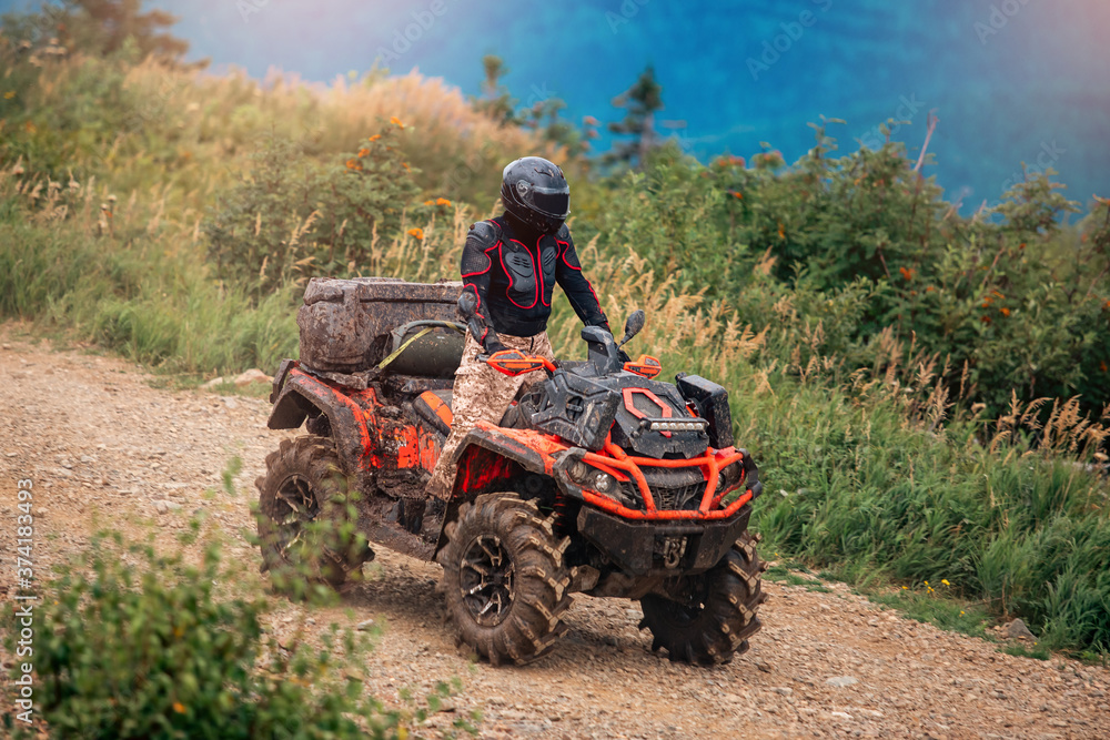 ATV bike rides through forest off-road in trip summer ATV bike rides through forest off-road in trip summer
