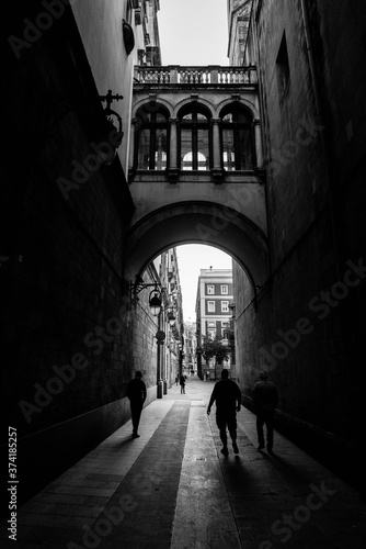 men walking in the gothic quarter of barcelona