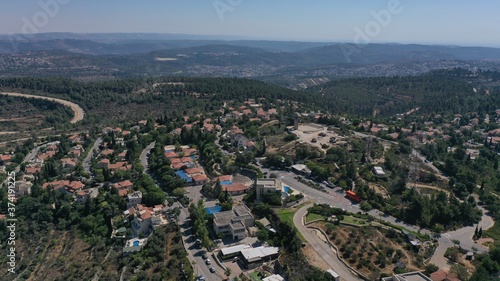 Small town with red rooftops Close to the Mountains Aerial view Drone, Har adar,August,2020,Israel 