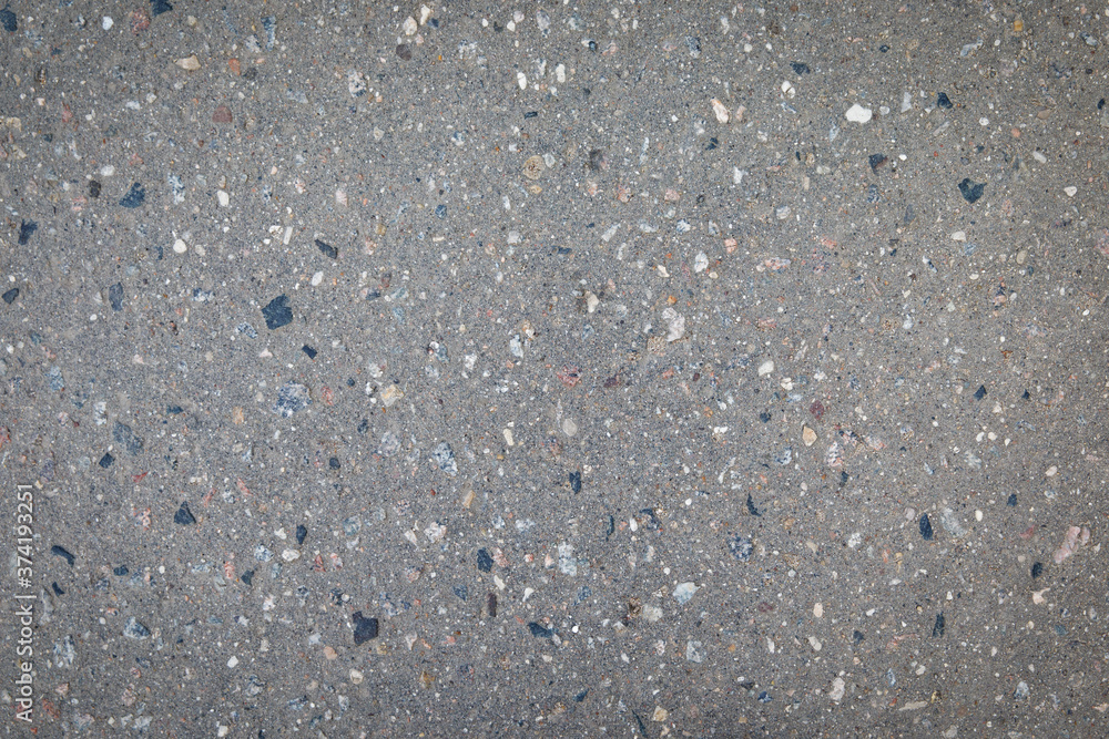Asphalt texture with stones. Gray background. Asphalt texture with stones. Gray background.