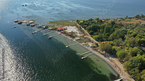 Aerial drone photo of artificial sea salt ponds in area Tourlida of Kleisova lagoon featuring seaside traditional settlement, Mesolongi, Aitoloakarnania, Greece photo