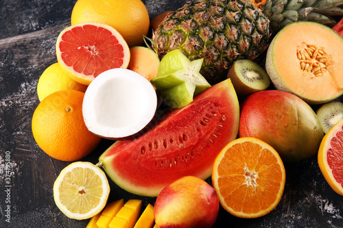 Fototapeta Naklejka Na Ścianę i Meble -  Tropical fruits background, many colorful ripe fresh tropical exotic fruits