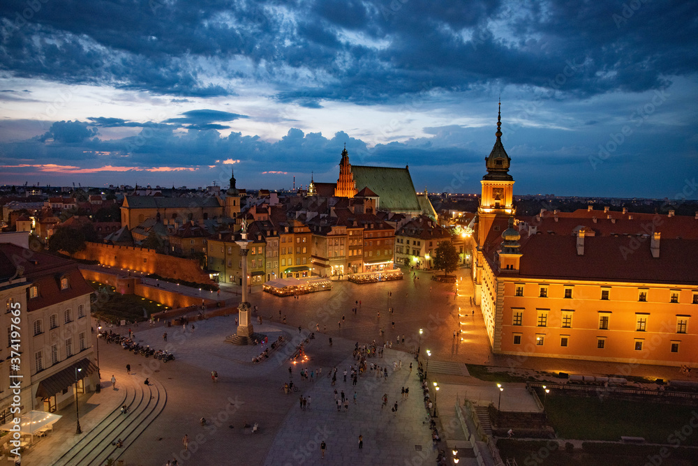 Panoramic view of Warsaw Castle Square in night in night with lots of lights