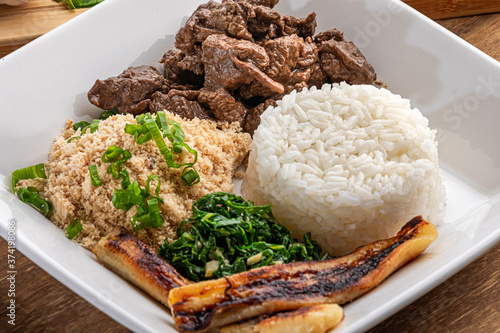 Minced beef tenderloin. Traditional Brazilian food (Picadinho). Selective focus photo