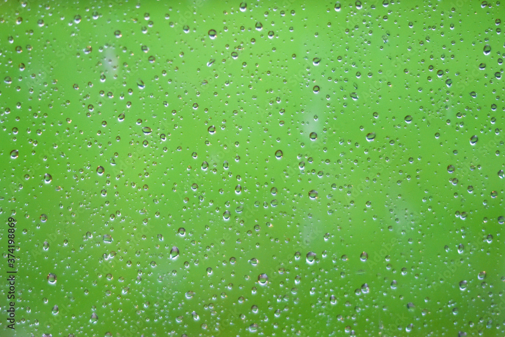 Water drops dripping on glass of window after rain Water drops dripping on glass of window after rain