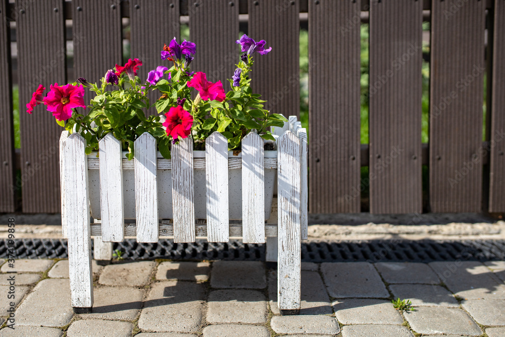 wooden decorative fence against the background of windows wooden decorative fence against the background of windows