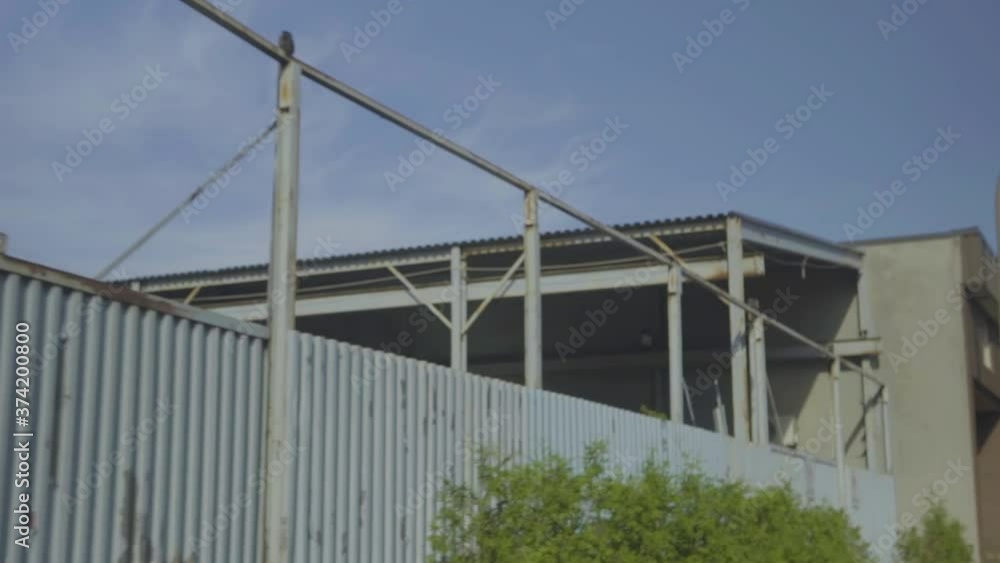 Montreal, Canada - September 11, 2018: An old warehouse building. Driving a car through industrial areas of a small town Montreal, Canada - September 11, 2018: An old warehouse building. Driving a car through industrial areas of a small town