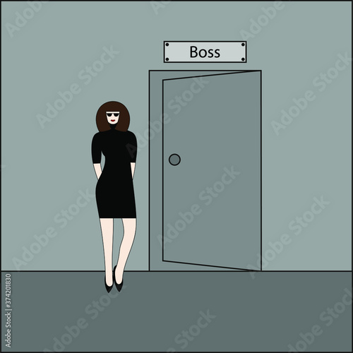 A woman stands near the door to her office