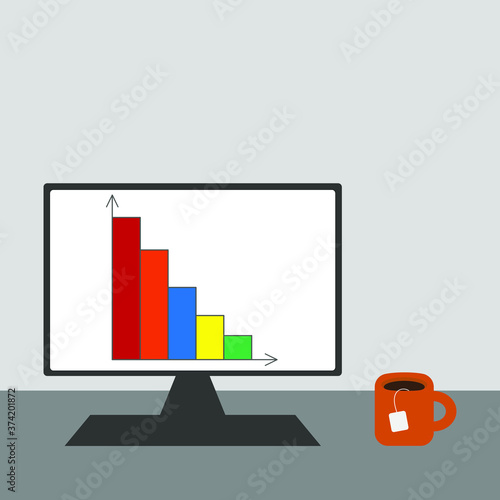 Computer screen with a diagram and a mug with a drink