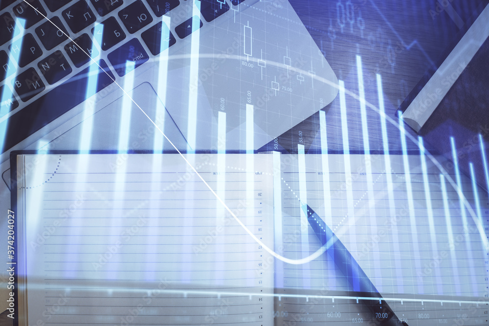 Stock market graph and top view computer on the table background. Multi exposure. Concept of financial education. Stock market graph and top view computer on the table background. Multi exposure. Concept of financial education.